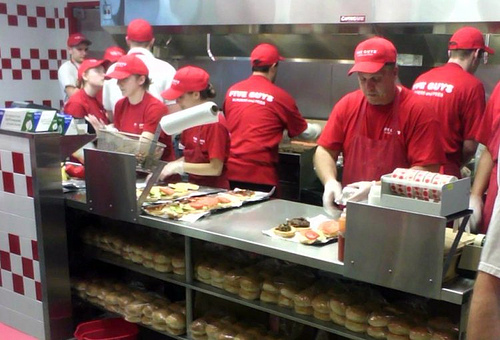 Photo of staff preparing food in a fast food chain